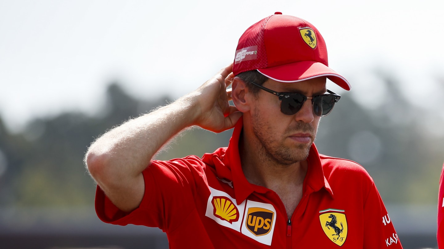 HOCKENHEIMRING, GERMANY - JULY 25: Sebastian Vettel, Ferrari walks the track with his mechanics