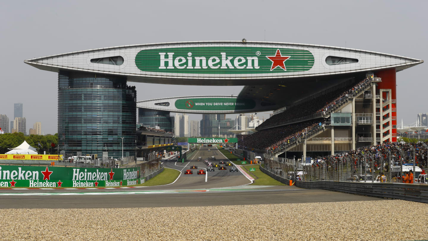 SHANGHAI INTERNATIONAL CIRCUIT, CHINA - APRIL 15: Sebastian Vettel, Ferrari SF71H, leads Kimi