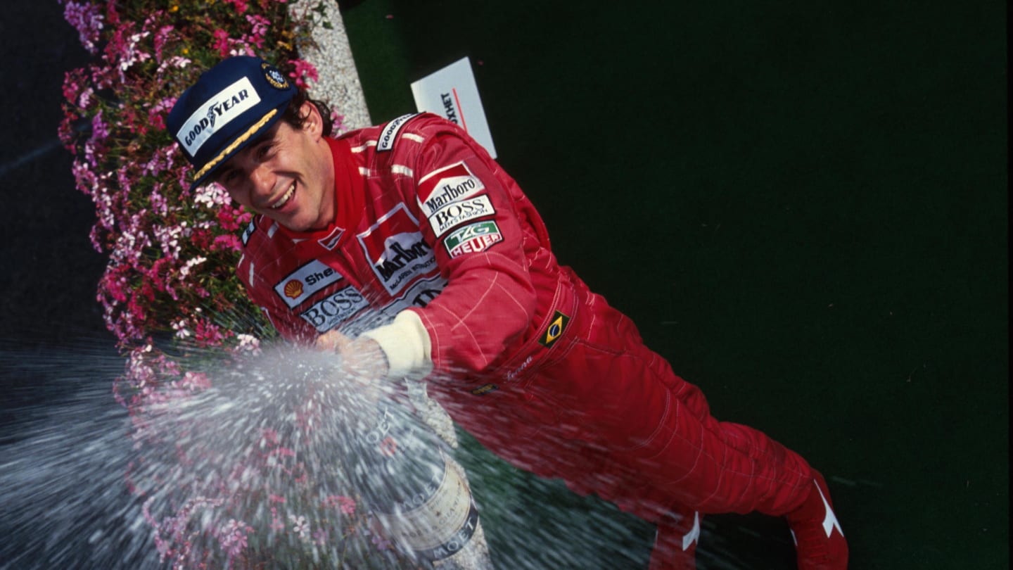 Race winner Ayrton Senna celebrates his victory on the podium.

Belgian Grand Prix, Spa, 25 August