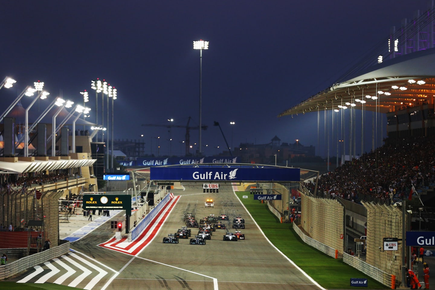 SAKHIR, BAHRAIN - APRIL 06:  Lewis Hamilton (L) of Great Britain and Mercedes GP and team mate Nico