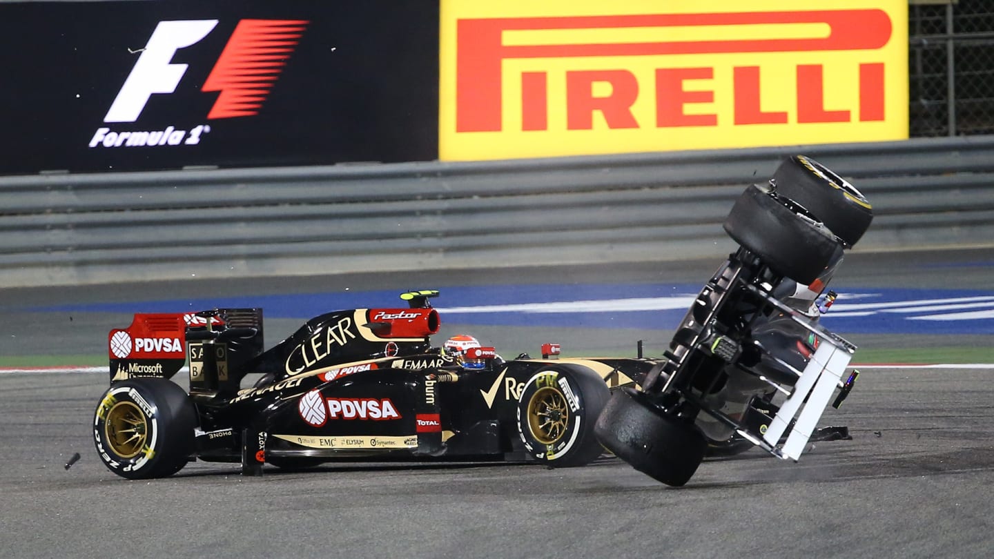 Sauber driver Esteban Gutierrez of Mexico crashes ahead of Lotus driver Pastor Maldonado of