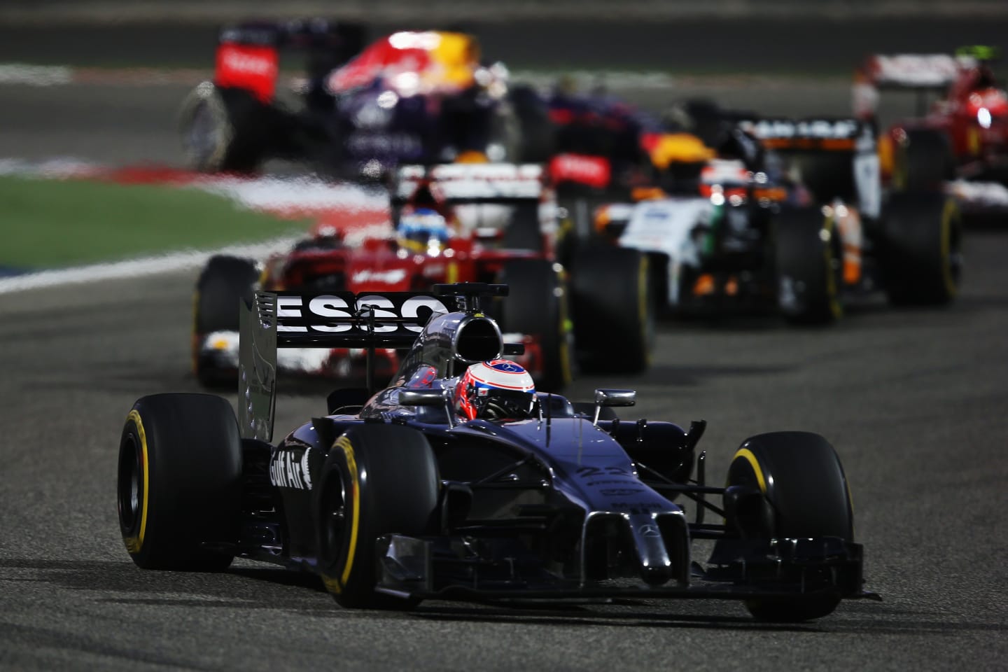 SAKHIR, BAHRAIN - APRIL 06:  Jenson Button of Great Britain and McLaren drives in his 250th Grand