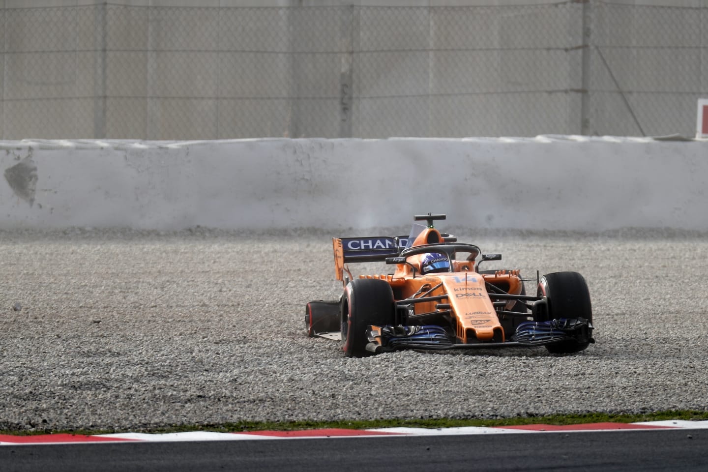Fernando Alonso (ESP) McLaren MCL33 in the gravel with missing rear wheel at Formula One Testing, Day One, Barcelona, Spain, 26 February 2018. © Sutton Images