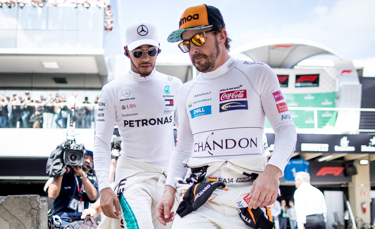 SAO PAULO, BRAZIL - NOVEMBER 11:  Fernando Alonso of Spain and McLaren F1 and Lewis Hamilton of