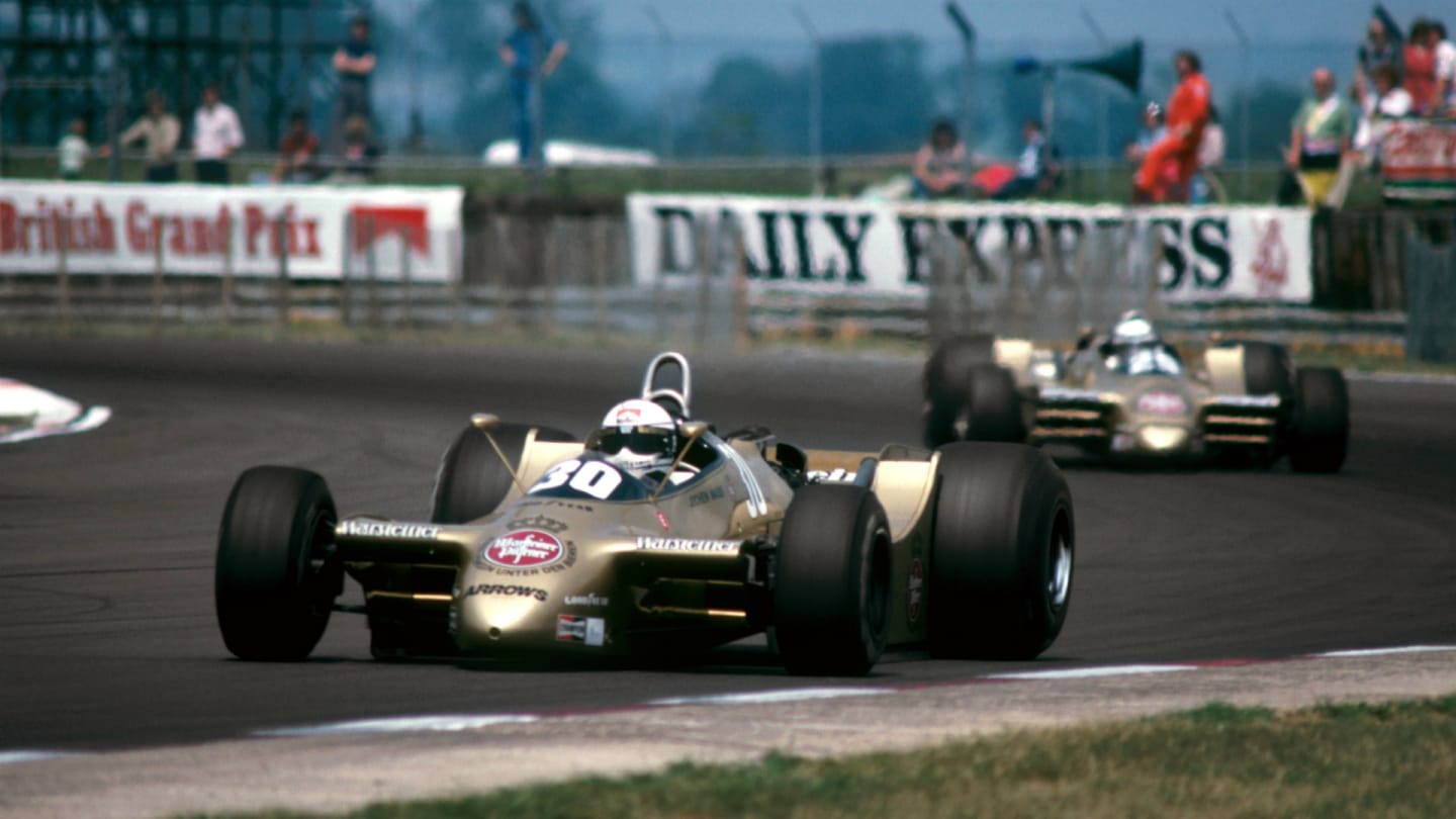  Jochen Mass (GER) Arrows A2, who retired from the race on lap 39 with a broken rear suspension link, leads his team mate Riccardo Patrese (ITA) Arrows A2, who retired from the race on lap 47 with gearbox problems. British Grand Prix, Rd 9, Silverstone, England, 14 July 1979.