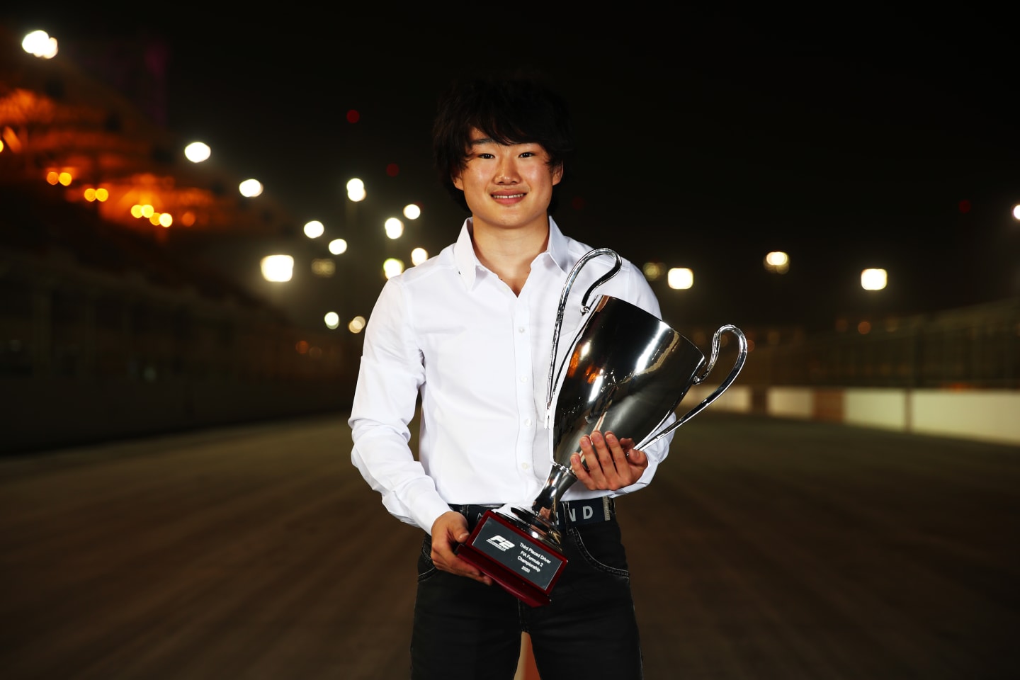 BAHRAIN, BAHRAIN - DECEMBER 06: 2020 F2 third placed driver Yuki Tsunoda of Japan and Carlin poses