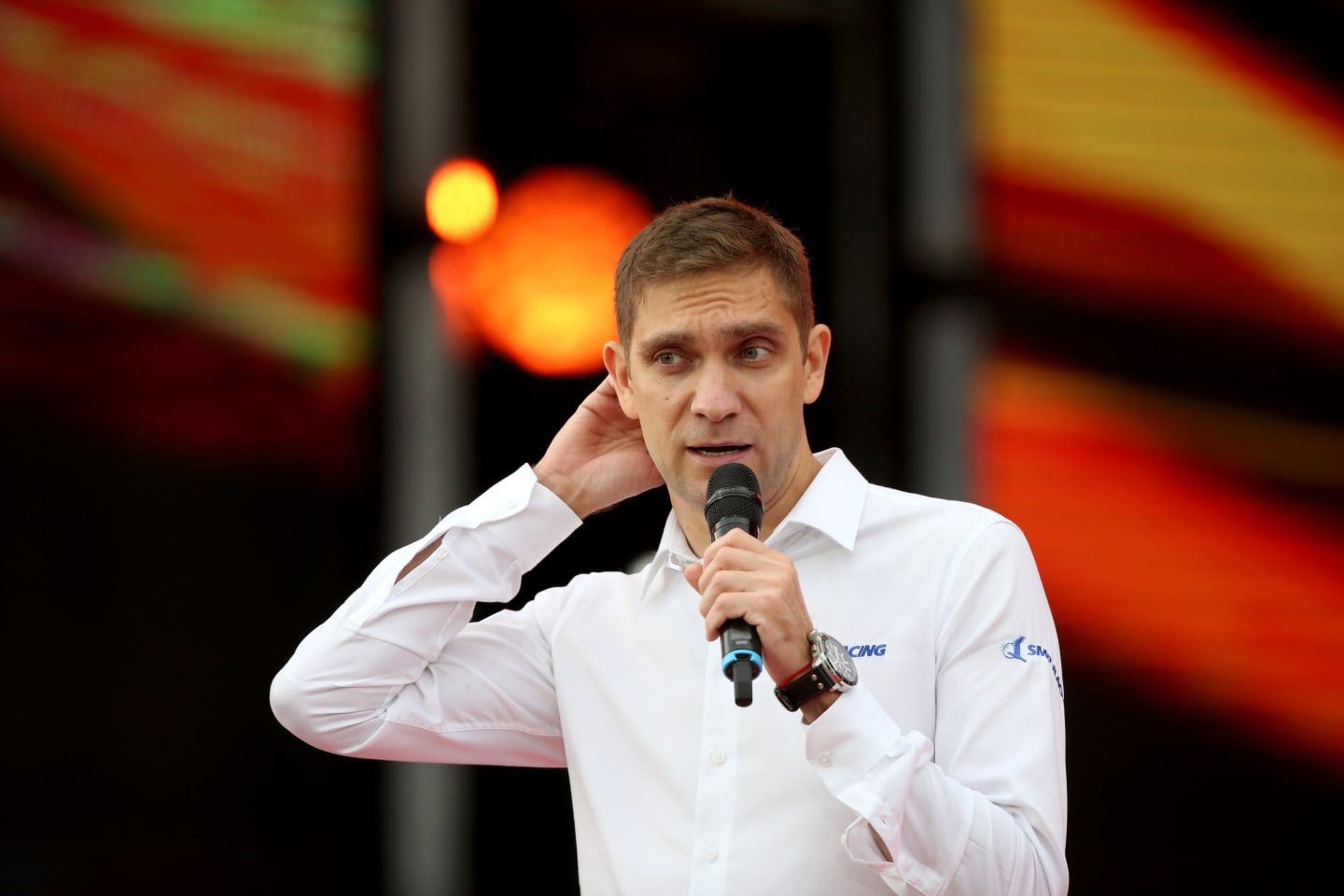SOCHI, RUSSIA - SEPTEMBER 26: Former F1 driver Vitaly Petrov hosts the fan stage during previews
