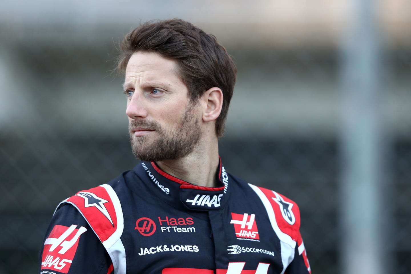 BARCELONA, SPAIN - FEBRUARY 19: Romain Grosjean of France and Haas F1 looks on as drivers line up