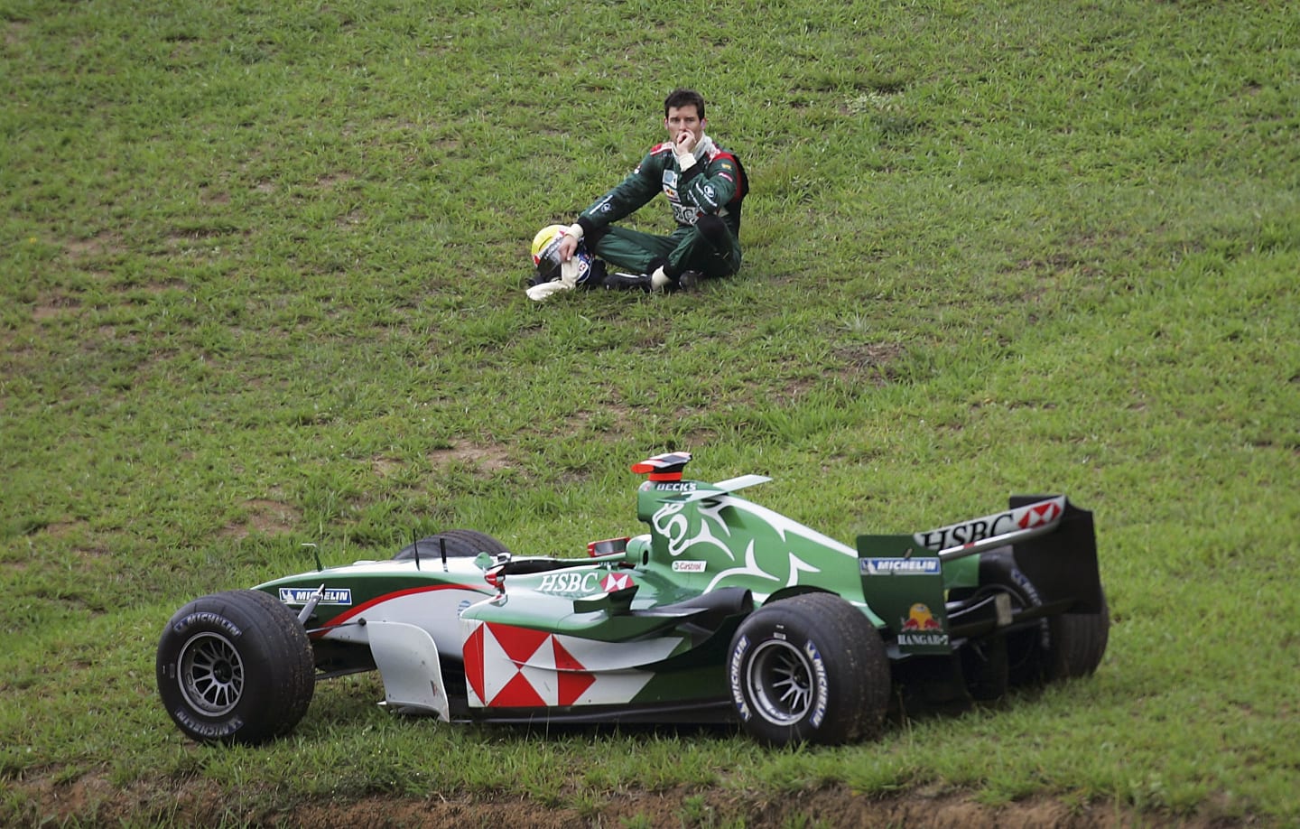 SAO PAULO, BRAZIL - OCTOBER 24:  Mark Webber of Australia and Jaguar watches the race after