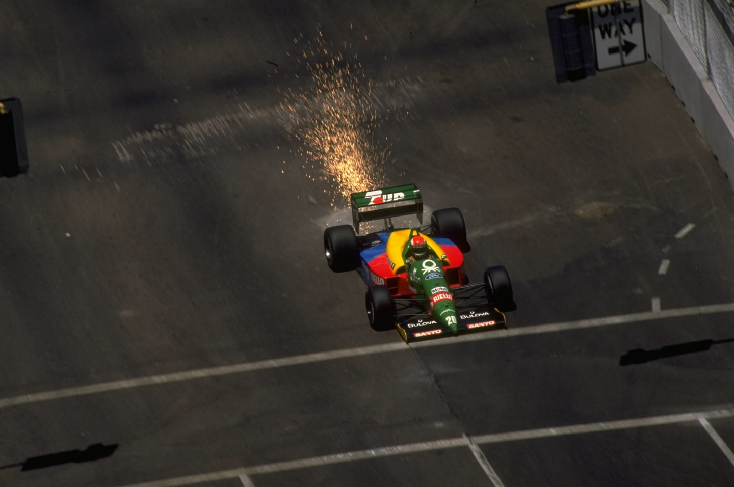 1989:  Johnny Herbert of Great Britain sets sparks flying in his Benetton Cosworth during the