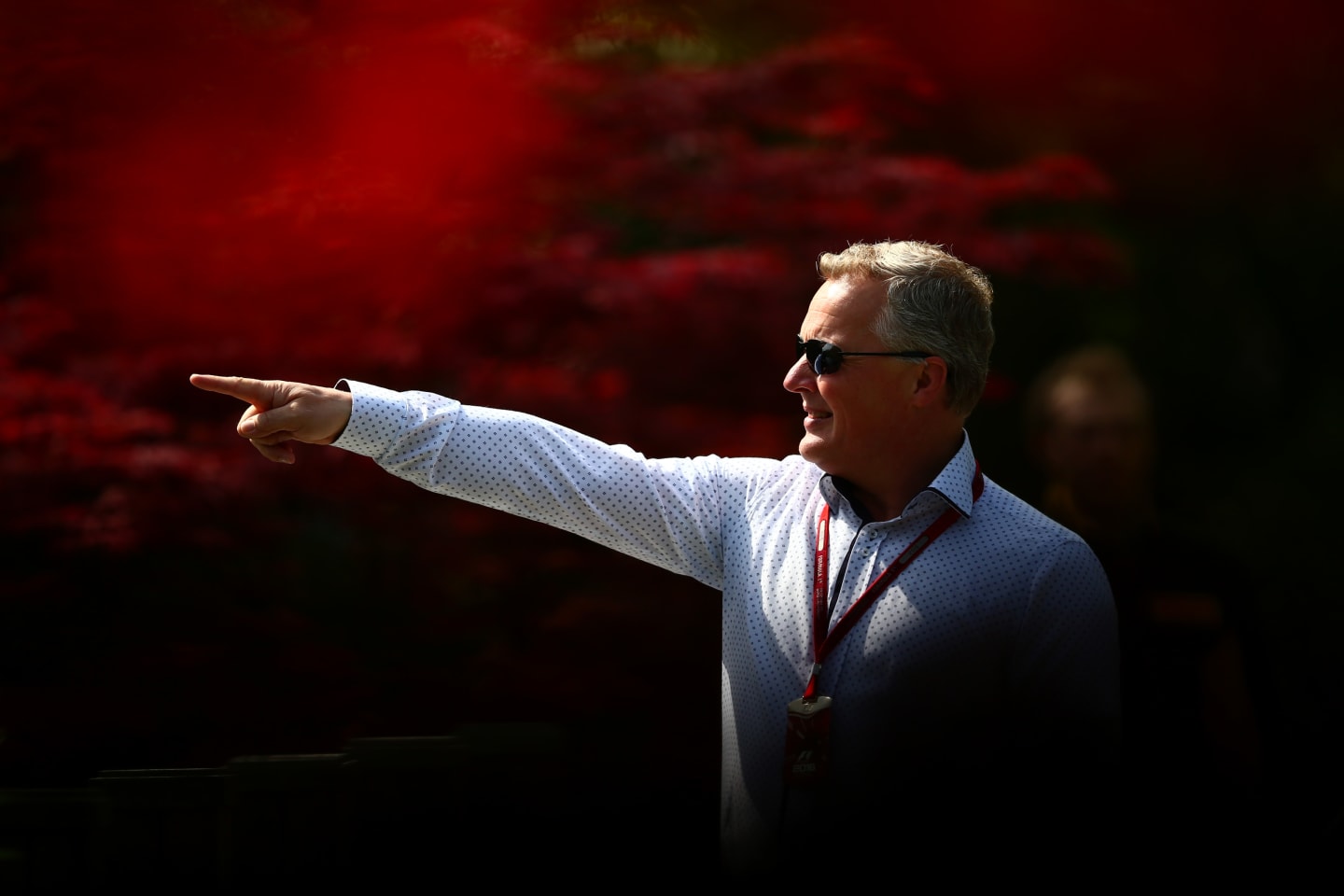 SHANGHAI, CHINA - APRIL 15: Johnny Herbert points at something in the Paddock during practice for