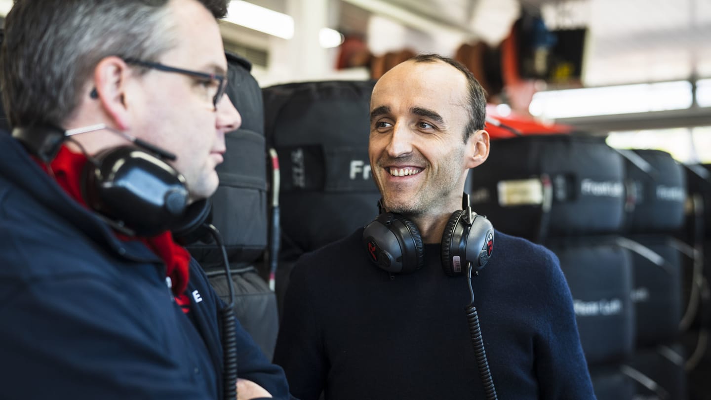 New reserve driver Robert Kubica was watching on from the pits