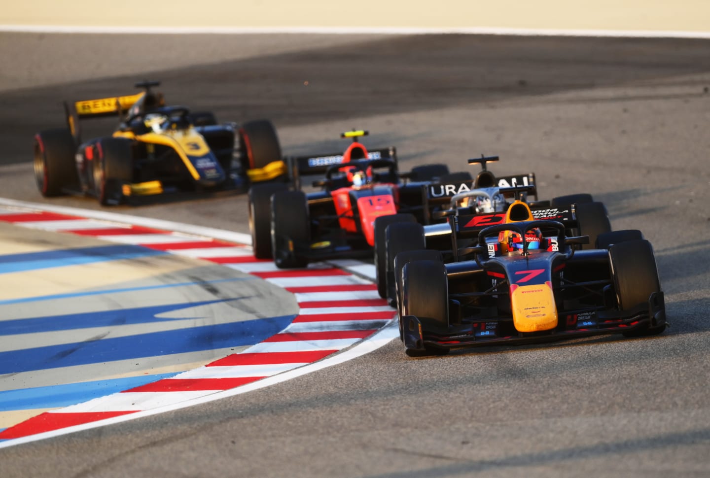 BAHRAIN, BAHRAIN - DECEMBER 05: Yuki Tsunoda of Japan and Carlin (7) drives leads a line of cars