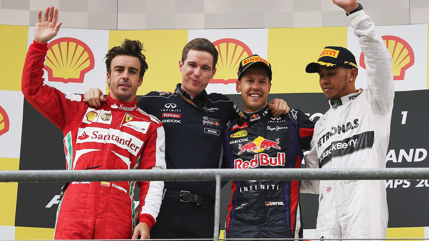 SPA, BELGIUM - AUGUST 25:  Race winner Sebastian Vettel (2nd right) of Germany and Infiniti Red