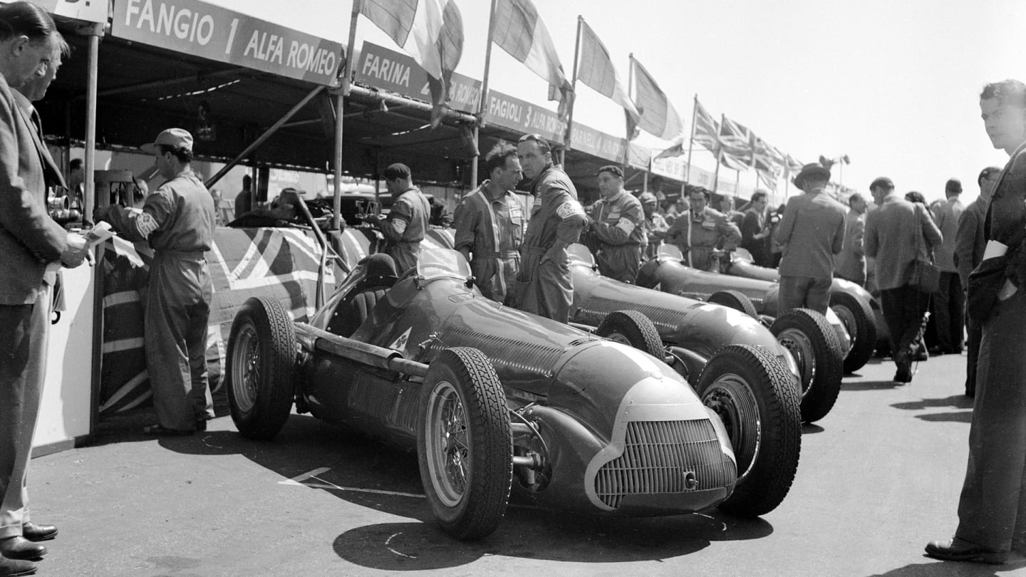 The British Grand Prix; Silverstone, May 13, 1950. The Alfa Romeo team cars lined up in front of