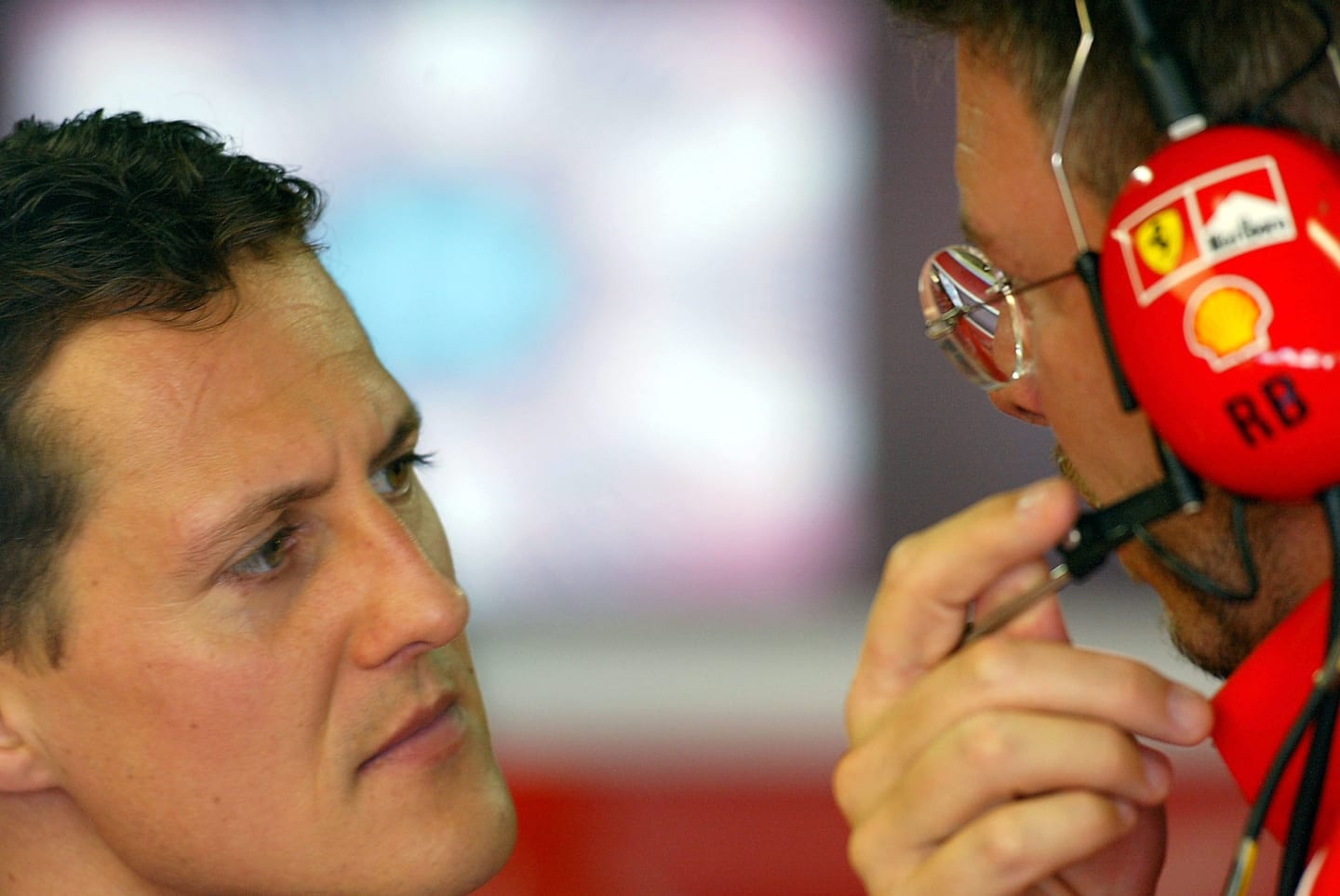 29 Mar 2002:  Michael Schumacher of Germany and Ferrari chats to Technical Director Ross Brawn