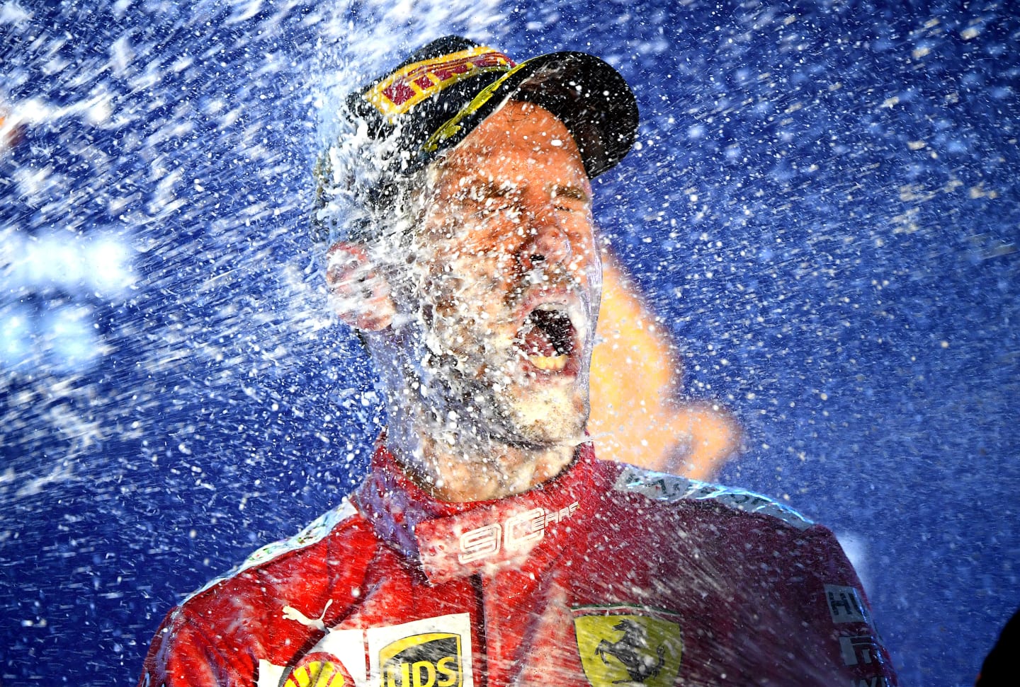 SINGAPORE, SINGAPORE - SEPTEMBER 22: Race winner Sebastian Vettel of Germany and Ferrari celebrates