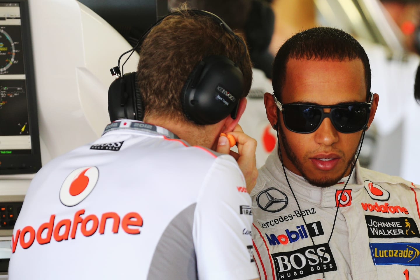 SUZUKA, JAPAN - OCTOBER 05:  Lewis Hamilton of Great Britain and McLaren talks with his performance