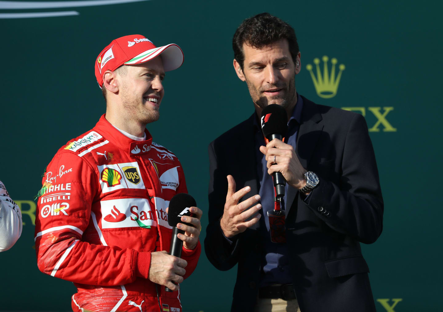 MELBOURNE, AUSTRALIA - MARCH 26: Race winner Sebastian Vettel of Germany and Ferrari talks with