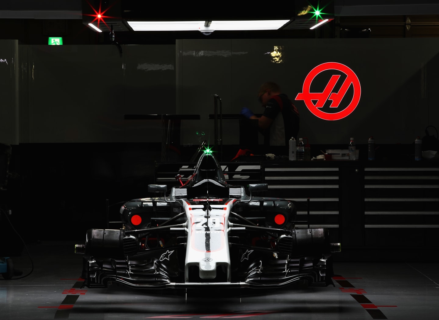 SUZUKA, JAPAN - OCTOBER 07: The car of Kevin Magnussen of Denmark and Haas F1 in the garage after
