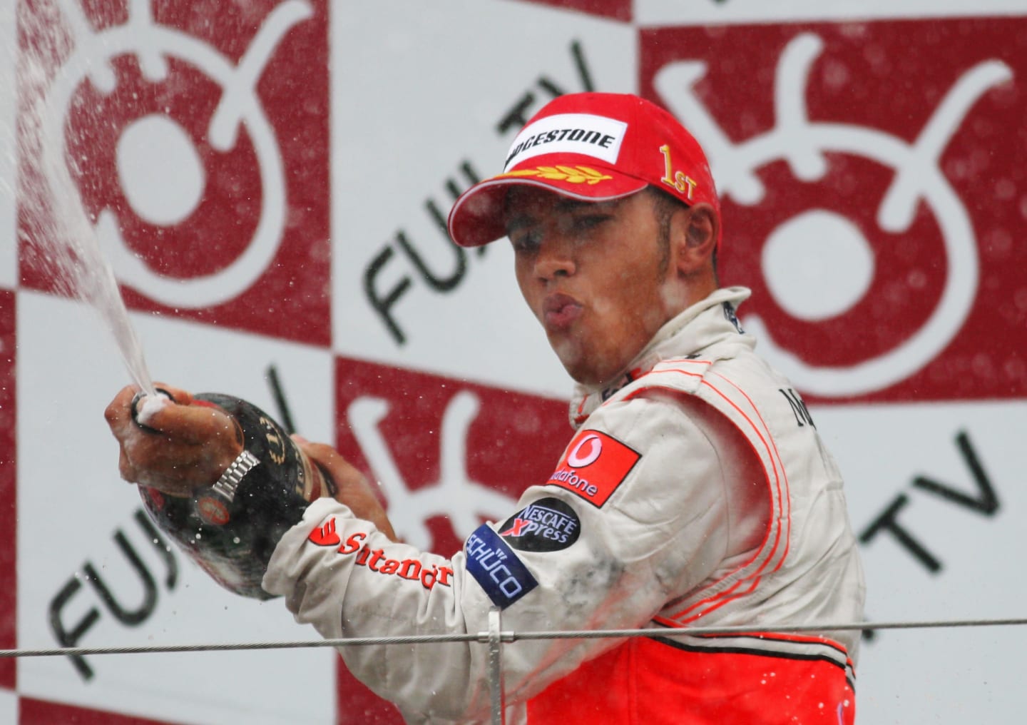 SHIZUOKA, JAPAN - SEPTEMBER 30:  Lewis Hamilton of Great Britain and McLaren Mercedes celebrates on