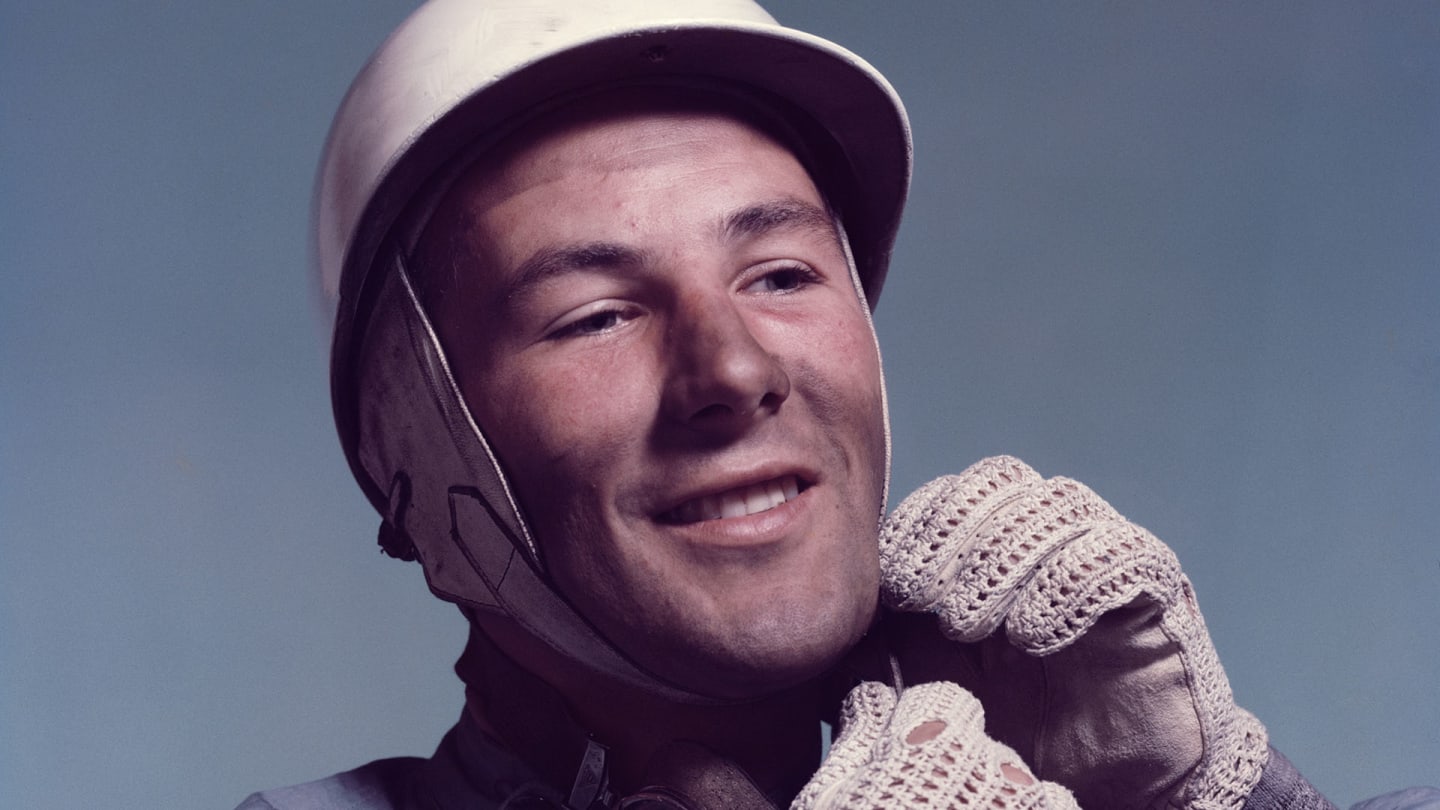 British racing driver Stirling Moss, circa 1955. He is wearing the badge of the British Racing