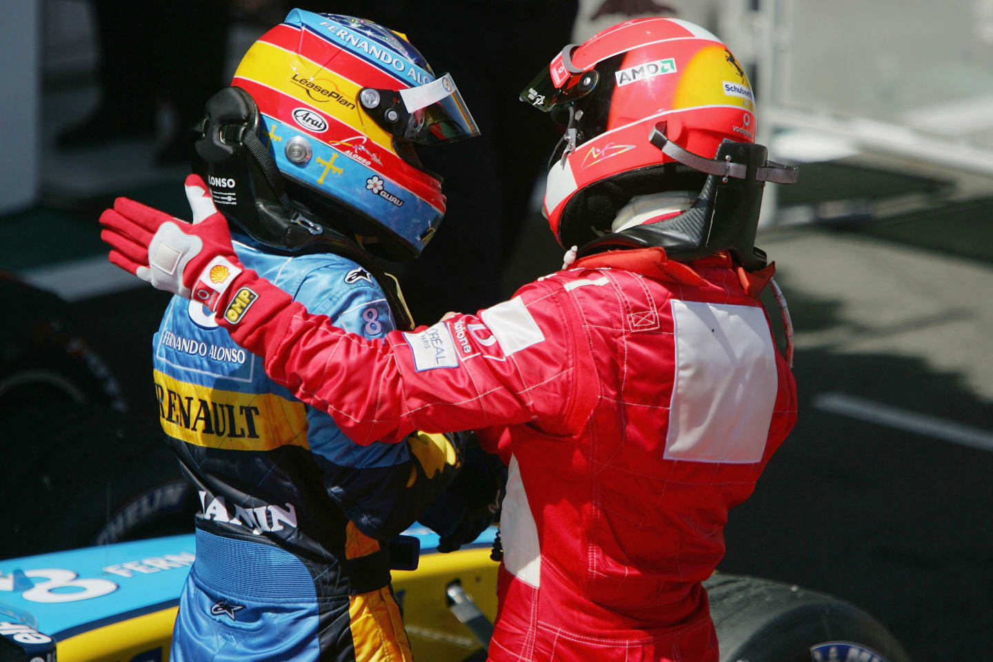 MAGNY-COURS, FRANCE - JULY 4:  Michael Schumacher of Germany and Ferrari congratulates Fernando