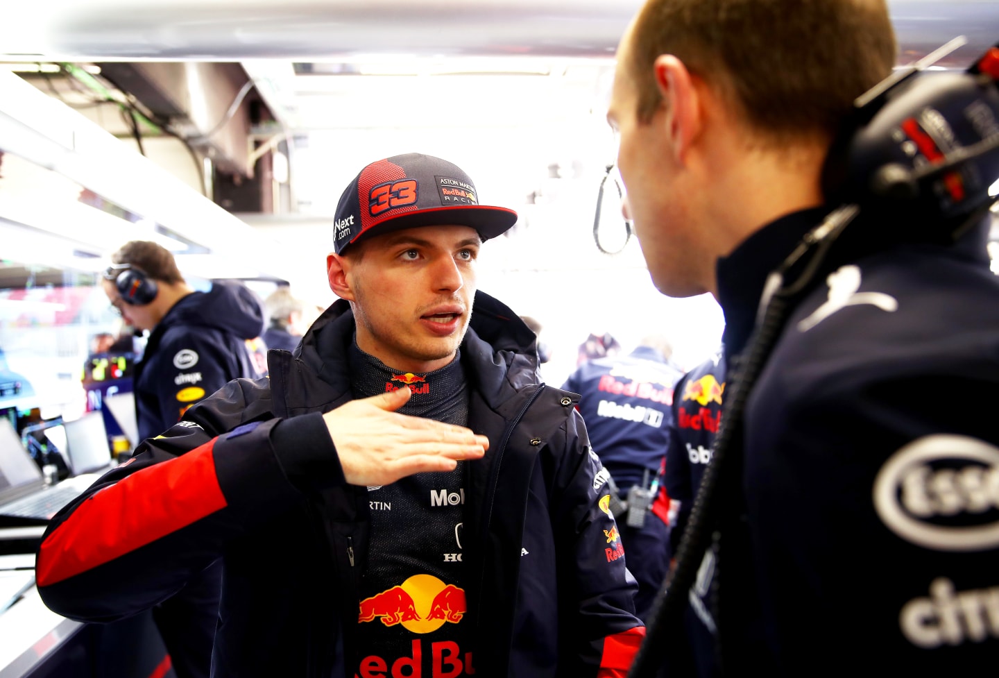 BARCELONA, SPAIN - FEBRUARY 19: Max Verstappen of Netherlands and Red Bull Racing talks with and
