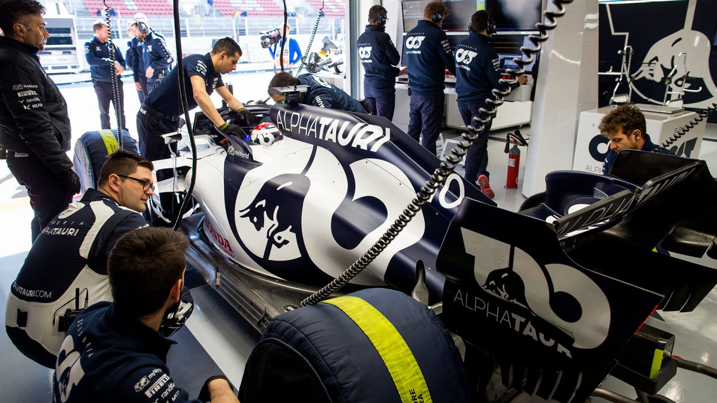 BARCELONA, SPAIN - FEBRUARY 20: The Scuderia AlphaTauri team work in the garage during day two of