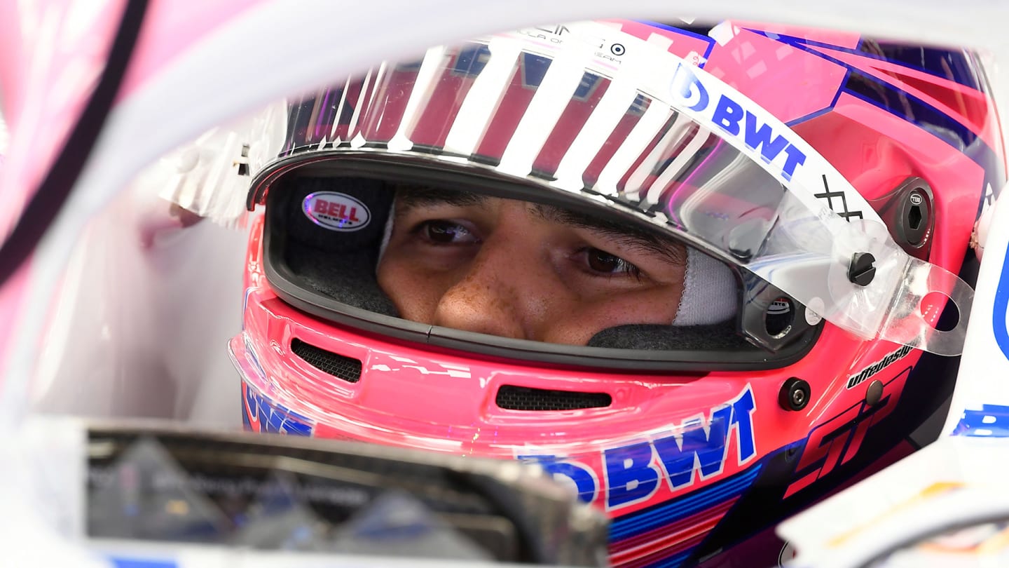 Racing Point's Mexican driver Sergio Perez sits in his car during the tests for the new Formula One