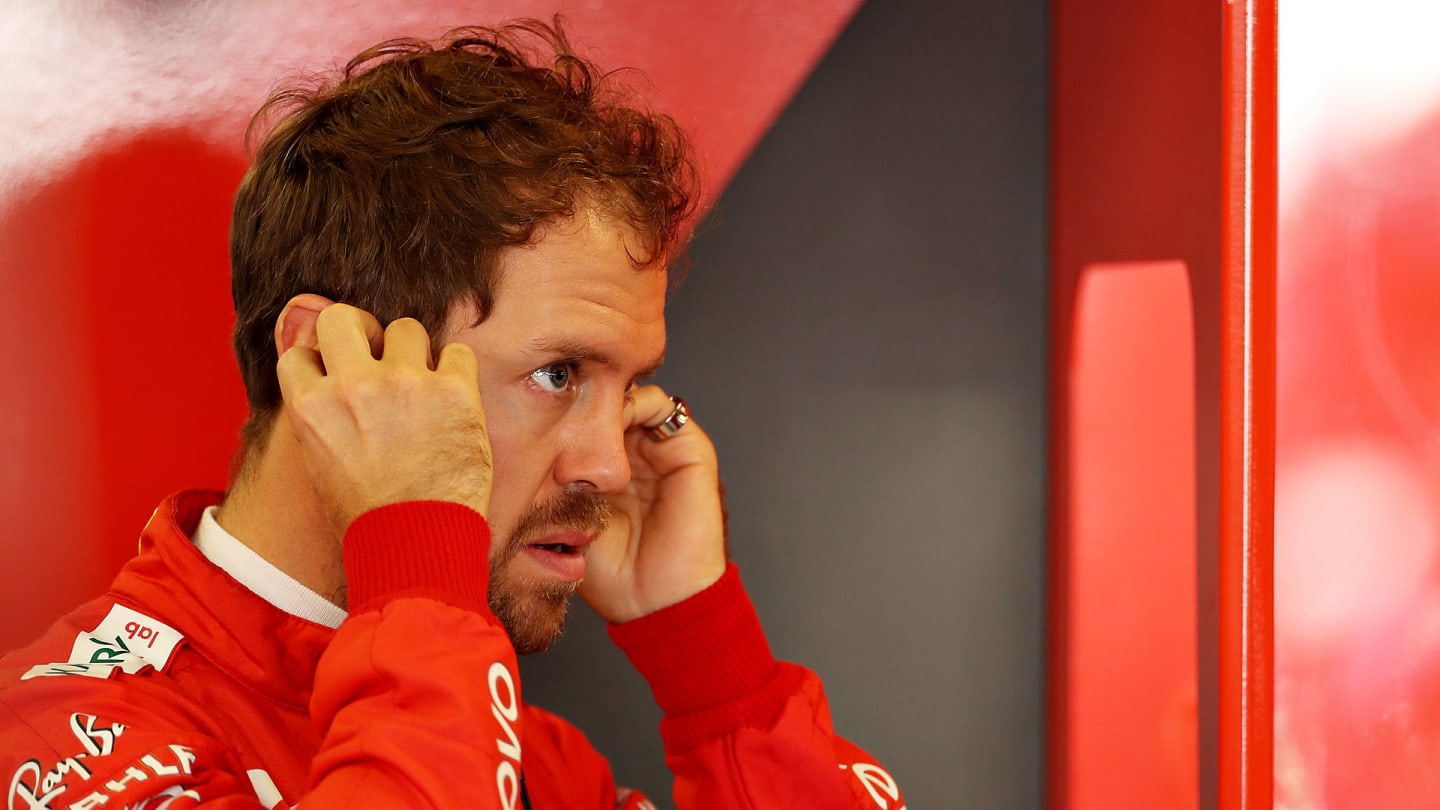 ABU DHABI, UNITED ARAB EMIRATES - NOVEMBER 30: Sebastian Vettel of Germany and Ferrari prepares to