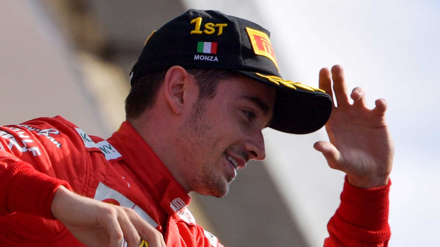 Winner Ferrari's Monegasque driver Charles Leclerc arrives on the podium after the Italian Formula