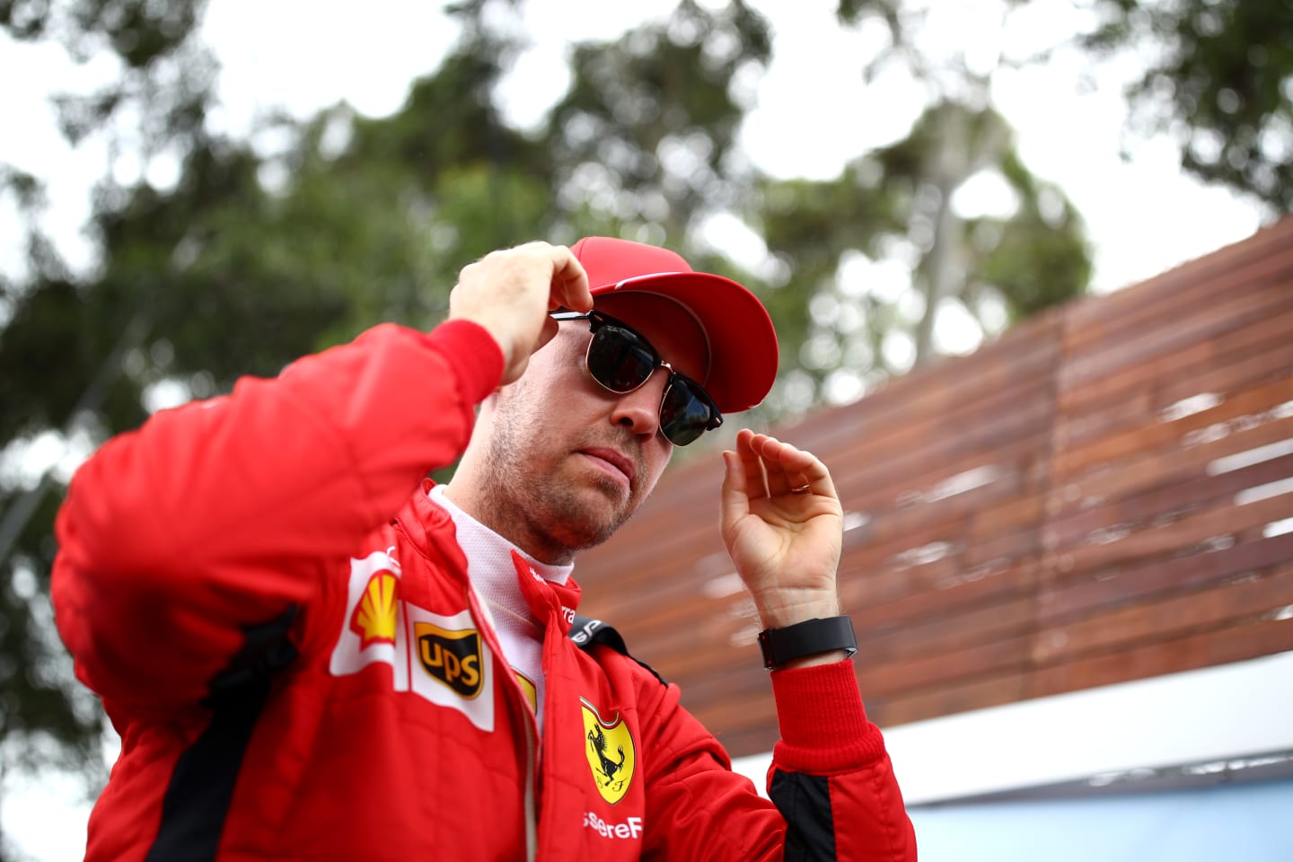 MELBOURNE, AUSTRALIA - MARCH 12: Sebastian Vettel of Germany and Ferrari looks on in the Paddock