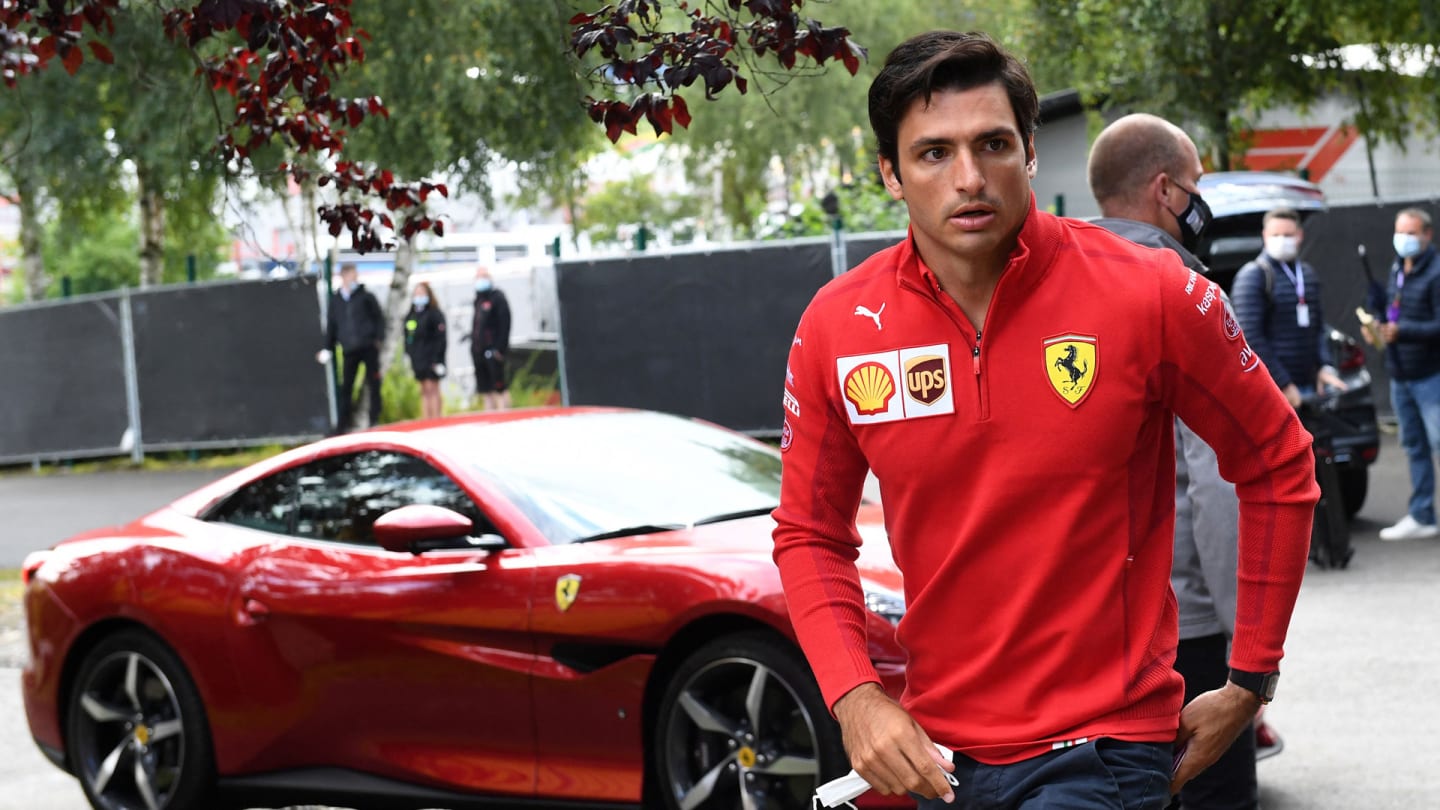 Ferrari's Spanish driver Carlos Sainz walks to the Paddock prior to previews ahead of the F1 2021