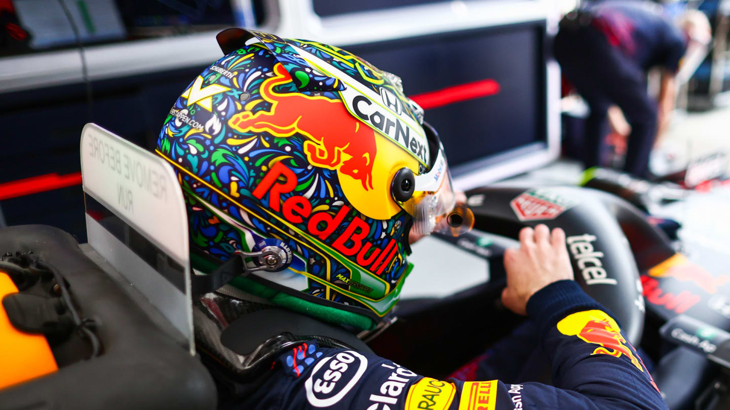 Verstappen gets into his car, sporting the new design, for FP1 in Brazil