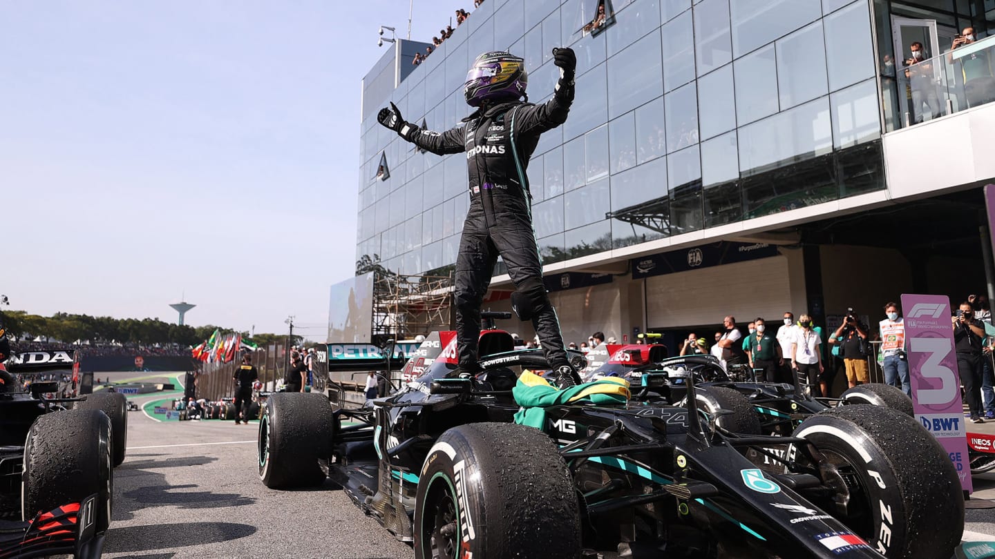 Mercedes' British driver Lewis Hamilton celebrates after winning Brazil's Formula One Sao Paulo