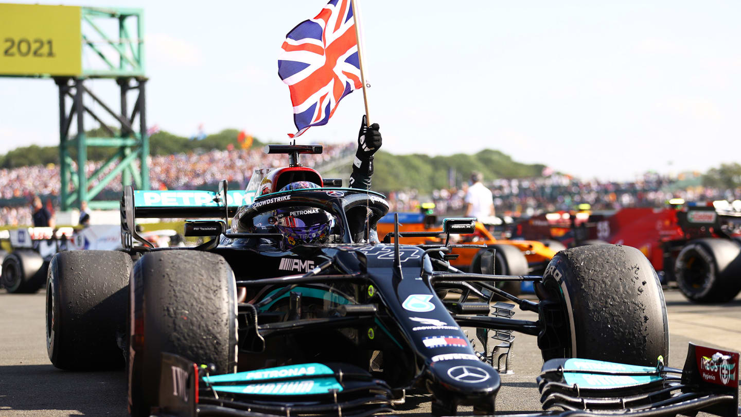 NORTHAMPTON, ENGLAND - JULY 18: Race winner Lewis Hamilton of Great Britain and Mercedes GP