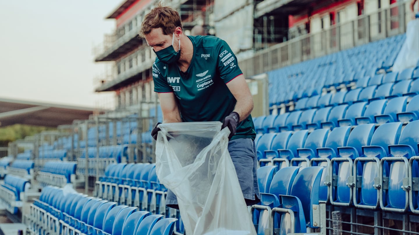 Vettel spent hours after the British Grand Prix on Sunday night picking up litter. Images courtesy of Aston Martin