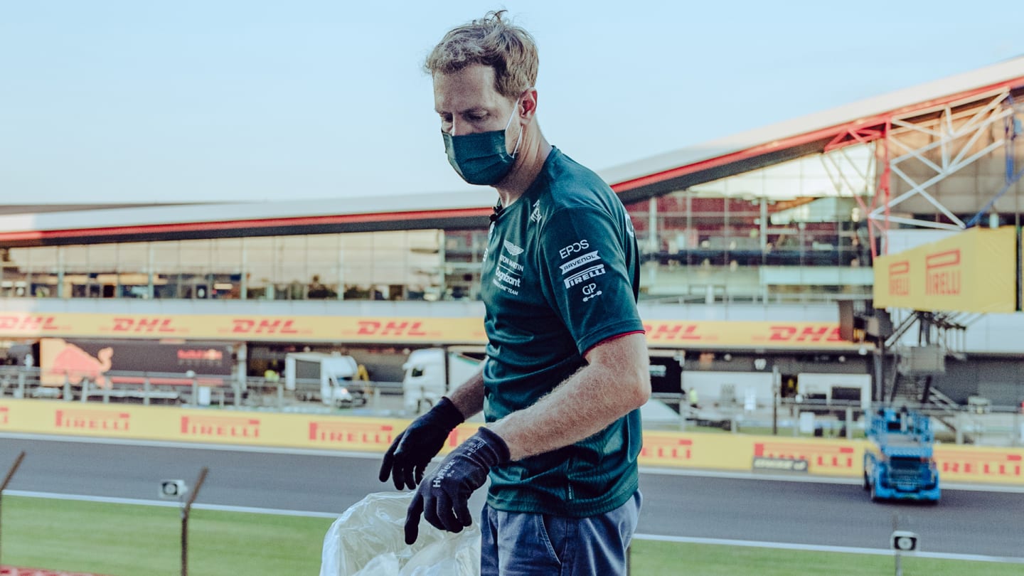 Vettel spent hours after the British Grand Prix on Sunday night picking up litter. Images courtesy of Aston Martin