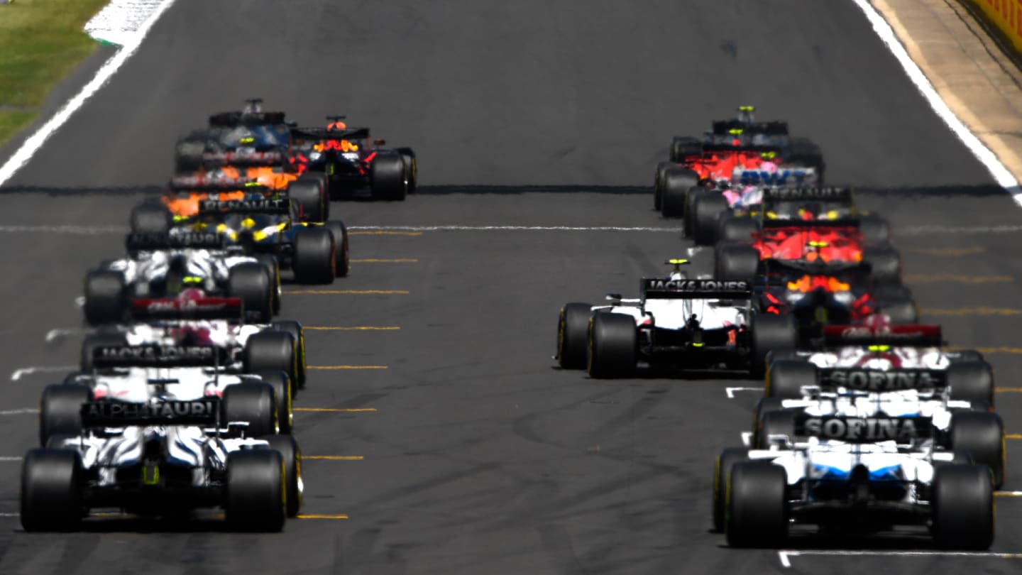 NORTHAMPTON, ENGLAND - AUGUST 02: A general view of the cars leaving the grid during the F1 Grand