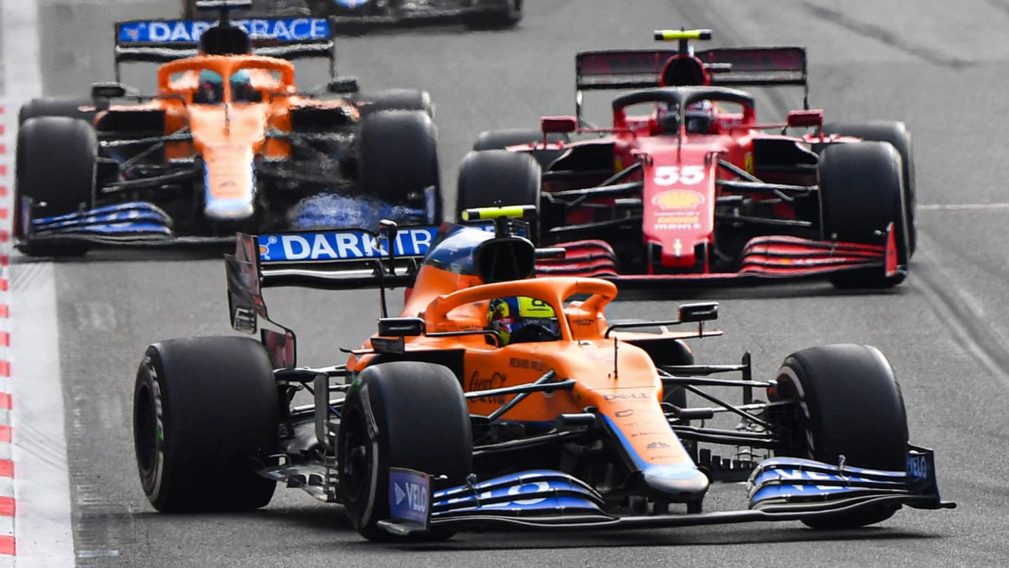 Lando Norris, McLaren MCL35M, leads Carlos Sainz, Ferrari SF21, Daniel Ricciardo, McLaren MCL35M,