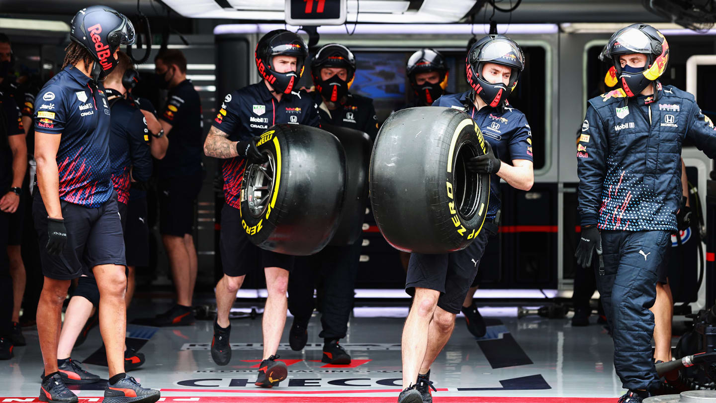 LE CASTELLET, FRANCE - JUNE 19: Red Bull Racing team members carry tyres out of the garage during