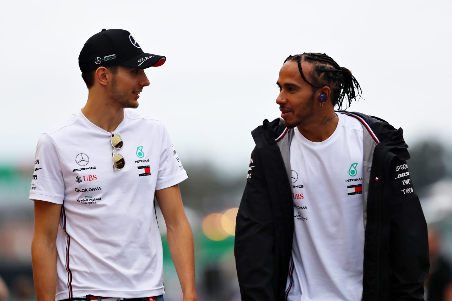 SUZUKA, JAPAN - OCTOBER 11: Lewis Hamilton of Great Britain and Mercedes GP and Esteban Ocon of