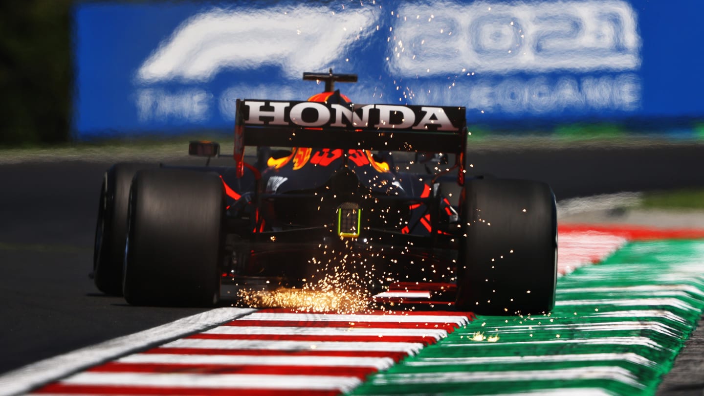 BUDAPEST, HUNGARY - JULY 30: Sparks fly behind Max Verstappen of the Netherlands driving the (33)