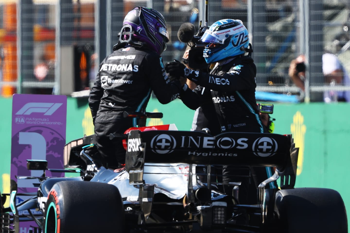BUDAPEST, HUNGARY - JULY 31: Pole position qualifier Lewis Hamilton of Great Britain and Mercedes GP and second place qualifier Valtteri Bottas of Finland and Mercedes GP celebrate in parc ferme during qualifying ahead of the F1 Grand Prix of Hungary at Hungaroring on July 31, 2021 in Budapest, Hungary. (Photo by Bryn Lennon/Getty Images)