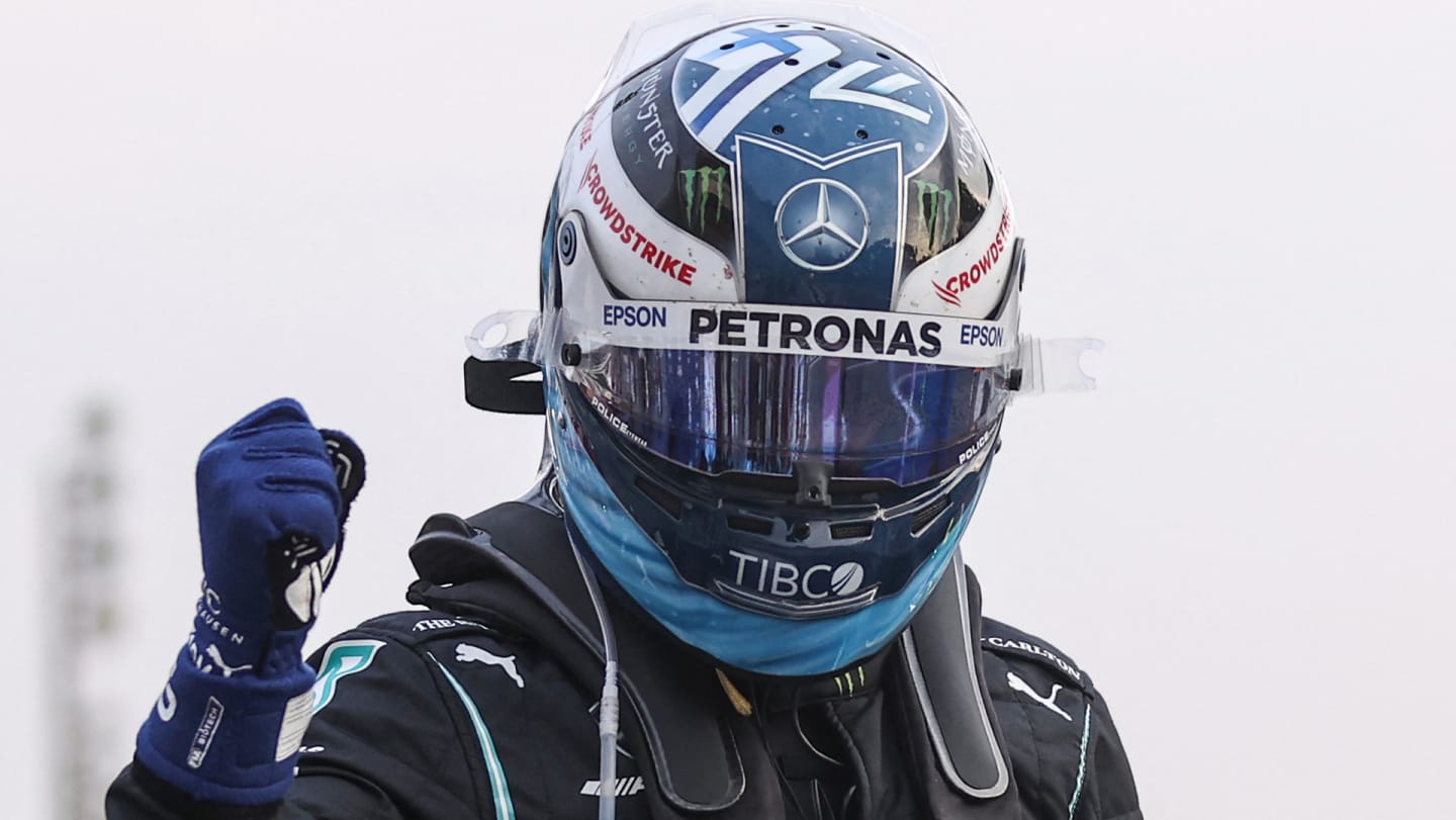 Mercedes' Finnish driver Valtteri Bottas reacts in the parc ferme after the qualifying sessions at
