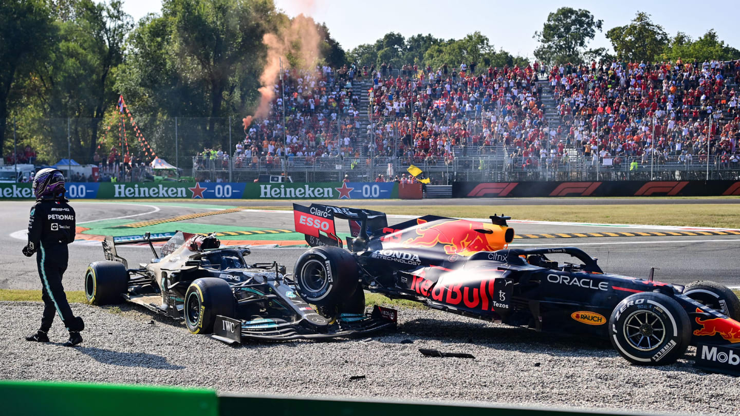 Mercedes' British driver Lewis Hamilton gets out of his car following a collision with Red Bull's