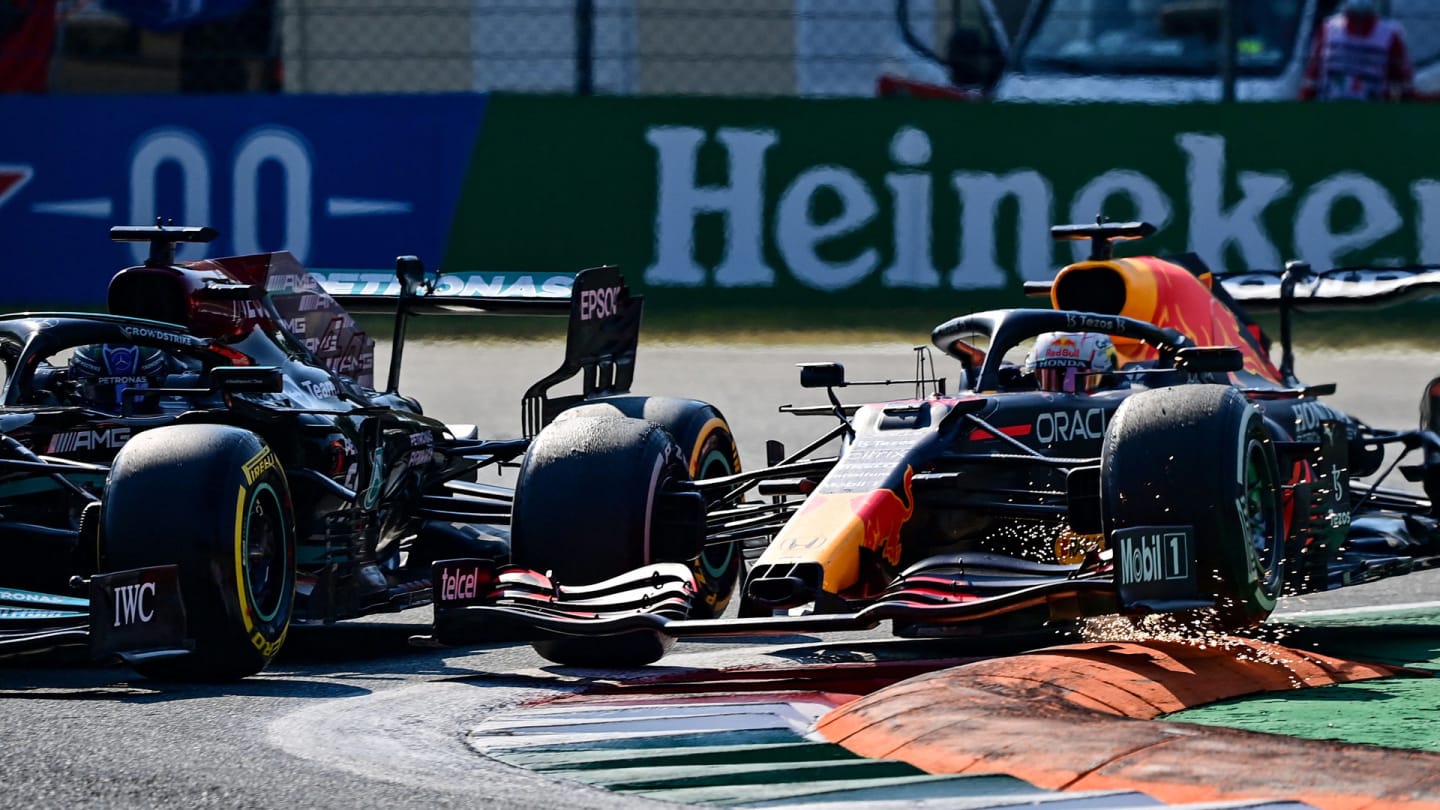 Red Bull's Dutch driver Max Verstappen (R) and Mercedes' British driver Lewis Hamilton collide