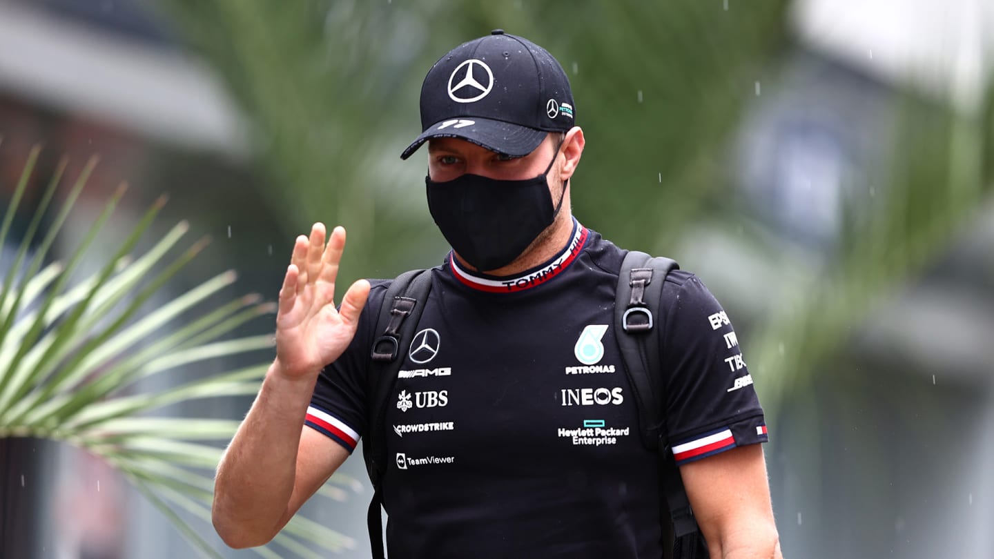 SOCHI, RUSSIA - SEPTEMBER 23: Valtteri Bottas of Finland and Mercedes GP walks in the Paddock