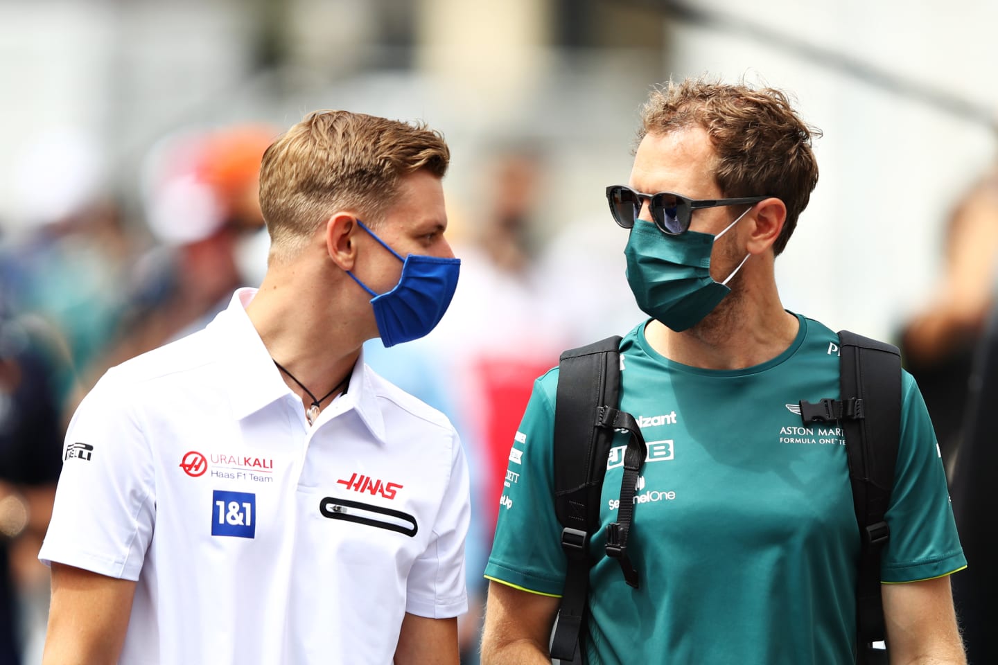 BAKU, AZERBAIJAN - JUNE 04: Mick Schumacher of Germany and Haas F1 talks with Sebastian Vettel of